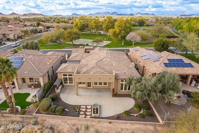 birds eye view of property with a mountain view