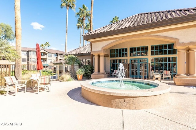 view of swimming pool featuring french doors