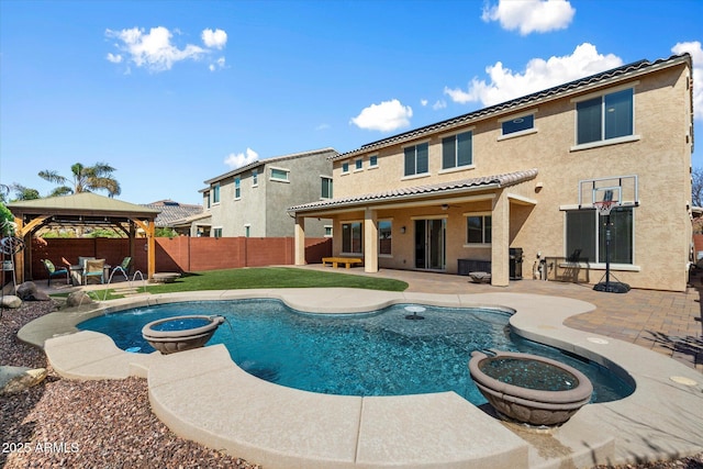 view of pool with a patio, a fenced in pool, a fenced backyard, a gazebo, and a fire pit