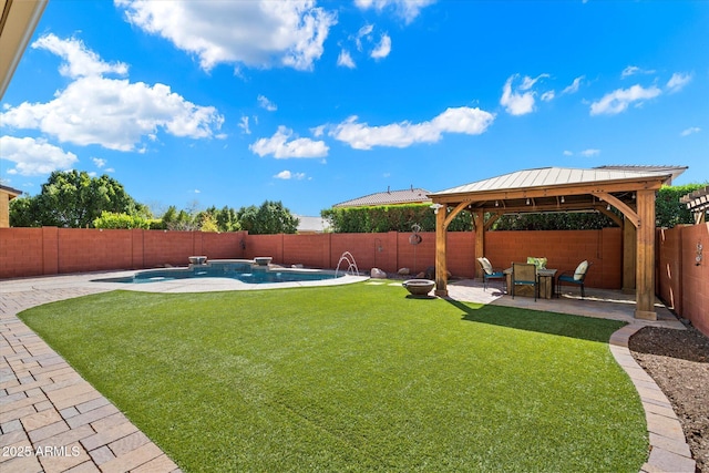 view of yard with a gazebo, a fenced in pool, a patio, and a fenced backyard