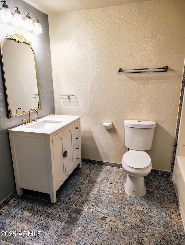 126 N 9th Ave, Phoenix, AZ 85007 - bathroom featuring vanity, a tub, and a textured wall