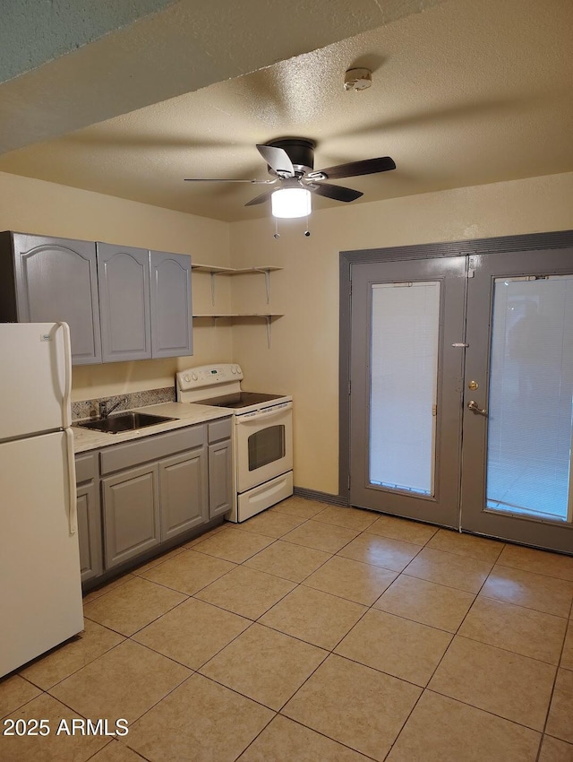 126 N 9th Ave, Phoenix, AZ 85007 - kitchen featuring white appliances, gray cabinetry, ceiling fan, light tile patterned floors, and a textured ceiling