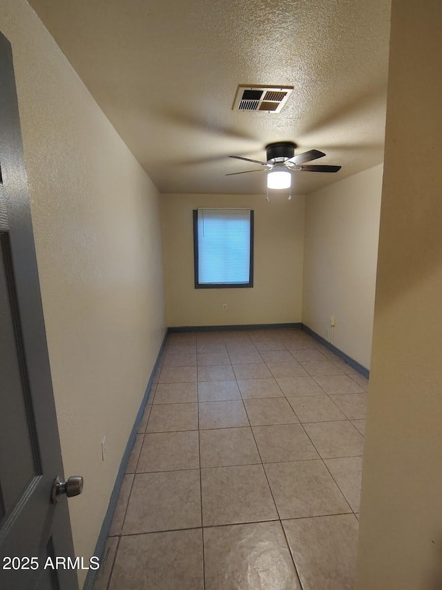 126 N 9th Ave, Phoenix, AZ 85007 - spare room with a textured ceiling, light tile patterned floors, and a ceiling fan