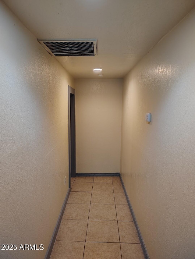 126 N 9th Ave, Phoenix, AZ 85007 - hall featuring light tile patterned floors and a textured wall