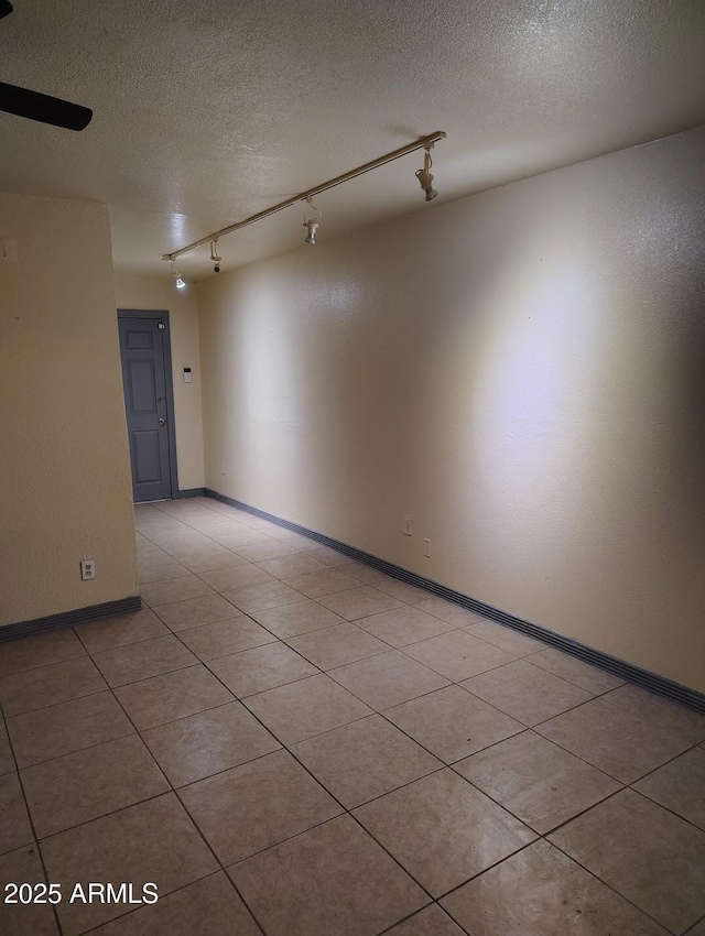 126 N 9th Ave, Phoenix, AZ 85007 - spare room featuring track lighting, a textured ceiling, and light tile patterned floors