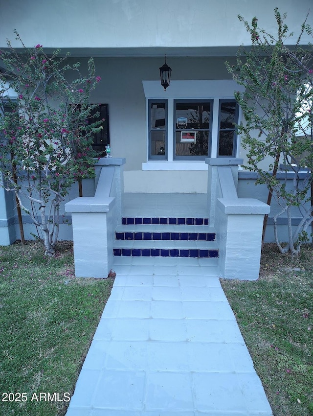 126 N 9th Ave, Phoenix, AZ 85007 - property entrance featuring a porch and a lawn