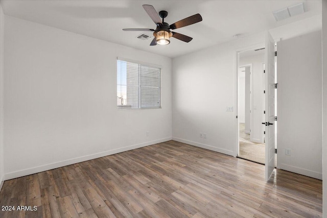 unfurnished room with light hardwood / wood-style flooring and ceiling fan