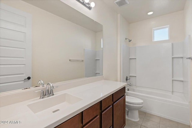 full bathroom featuring toilet, vanity, tile patterned floors, and shower / washtub combination