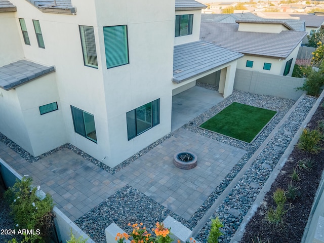 view of building exterior with a fire pit