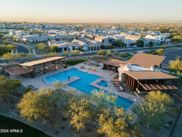 view of pool at dusk