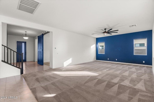 tiled empty room with ceiling fan