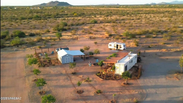 aerial view featuring view of desert, a rural view, and a mountain view