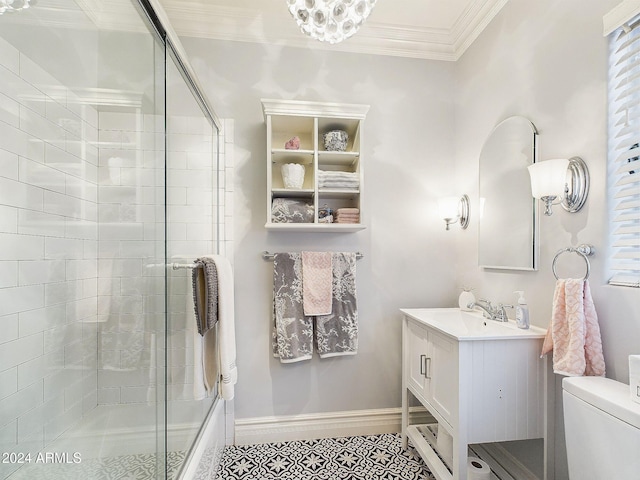 bathroom with ornamental molding, vanity, toilet, and a shower with door