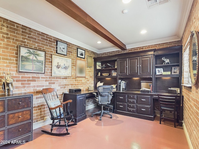 office space with beamed ceiling, built in desk, crown molding, and brick wall