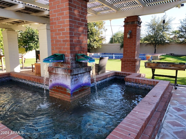 view of patio / terrace featuring a pergola and pool water feature