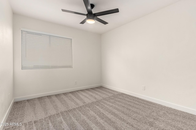 empty room with carpet floors and ceiling fan