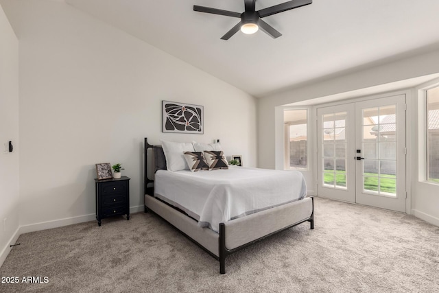 bedroom featuring light carpet, access to exterior, lofted ceiling, and french doors