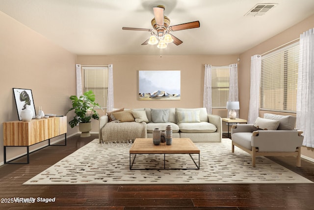 9207 W Kirby Ave, Tolleson, AZ 85353 - living room featuring ceiling fan, dark wood-style flooring, and baseboards