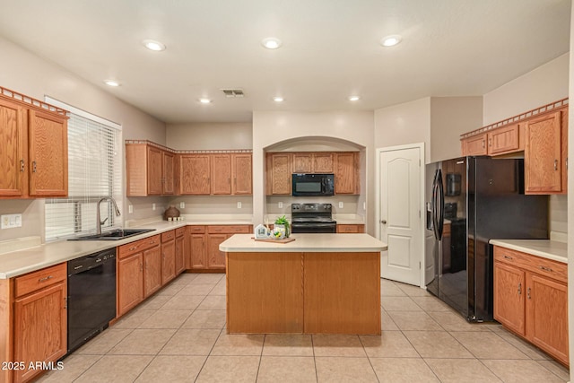 9207 W Kirby Ave, Tolleson, AZ 85353 - kitchen featuring black appliances, a sink, a center island, light countertops, and recessed lighting