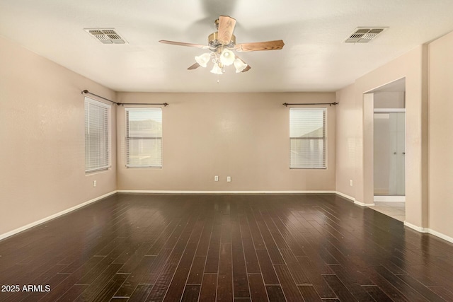 9207 W Kirby Ave, Tolleson, AZ 85353 - spare room with a ceiling fan, wood finished floors, and baseboards