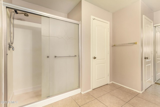 9207 W Kirby Ave, Tolleson, AZ 85353 - full bath featuring tile patterned floors, a shower stall, and baseboards