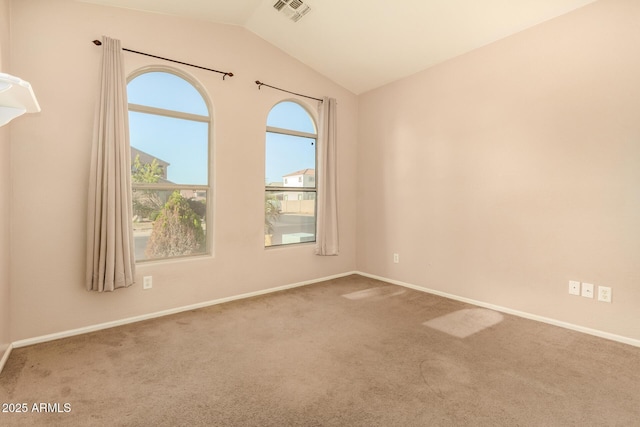 9207 W Kirby Ave, Tolleson, AZ 85353 - spare room featuring carpet flooring, lofted ceiling, and baseboards