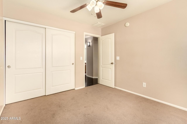 9207 W Kirby Ave, Tolleson, AZ 85353 - unfurnished bedroom featuring carpet, a closet, baseboards, and ceiling fan