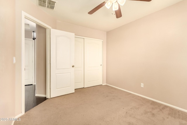 9207 W Kirby Ave, Tolleson, AZ 85353 - unfurnished bedroom featuring carpet, baseboards, a closet, and a ceiling fan