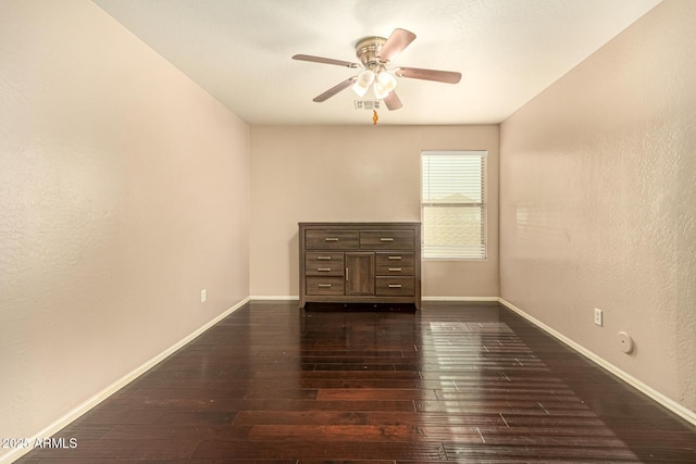 9207 W Kirby Ave, Tolleson, AZ 85353 - spare room with ceiling fan, baseboards, and dark wood-style floors