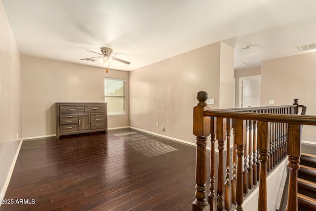 9207 W Kirby Ave, Tolleson, AZ 85353 - spare room featuring baseboards, dark wood-type flooring, and ceiling fan