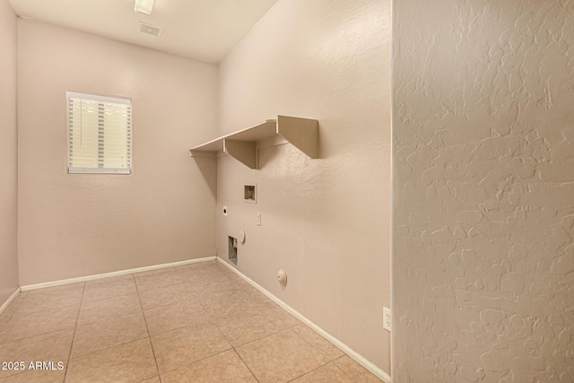 9207 W Kirby Ave, Tolleson, AZ 85353 - washroom with washer hookup, gas dryer hookup, electric dryer hookup, light tile patterned flooring, and baseboards