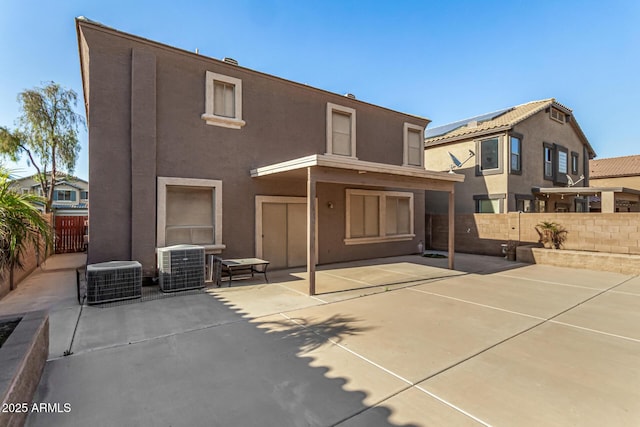 9207 W Kirby Ave, Tolleson, AZ 85353 - rear view of house with central AC, a patio, stucco siding, and a fenced backyard