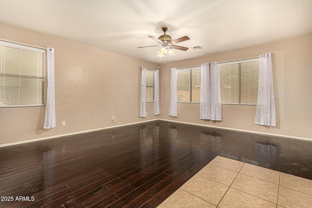 9207 W Kirby Ave, Tolleson, AZ 85353 - spare room with wood-type flooring, ceiling fan, and baseboards