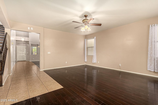 9207 W Kirby Ave, Tolleson, AZ 85353 - spare room featuring ceiling fan, hardwood / wood-style flooring, and baseboards