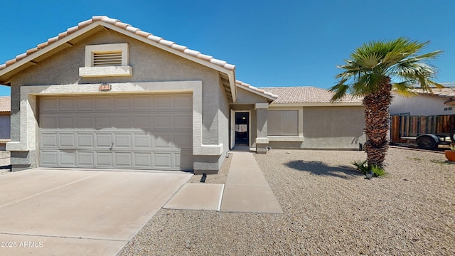 884 W 15th Ave, Apache Junction, AZ 85120 - view of front of house with a tile roof, stucco siding, driveway, and an attached garage