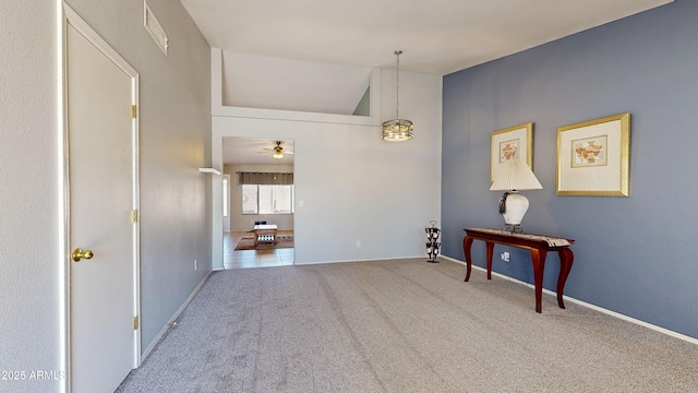 884 W 15th Ave, Apache Junction, AZ 85120 - empty room featuring a ceiling fan, vaulted ceiling, carpet flooring, and baseboards