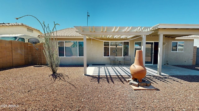 884 W 15th Ave, Apache Junction, AZ 85120 - back of house featuring fence, a pergola, a patio, stucco siding, and a tiled roof