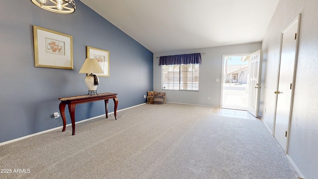 884 W 15th Ave, Apache Junction, AZ 85120 - empty room featuring carpet floors, lofted ceiling, and baseboards