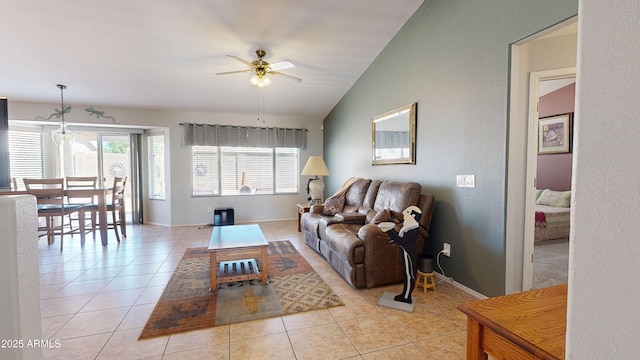 884 W 15th Ave, Apache Junction, AZ 85120 - living room featuring ceiling fan, light tile patterned floors, baseboards, and vaulted ceiling