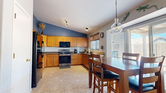 884 W 15th Ave, Apache Junction, AZ 85120 - kitchen featuring black appliances, lofted ceiling, a sink, light tile patterned floors, and pendant lighting
