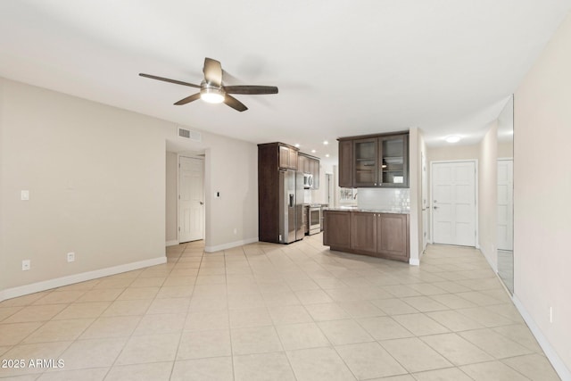 5998 N 78th St Unit 116, Scottsdale, AZ 85250 - unfurnished living room with a ceiling fan, baseboards, light tile patterned floors, and visible vents