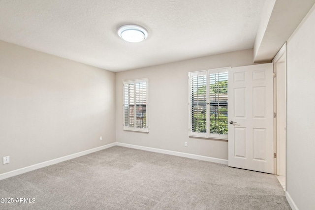 5998 N 78th St Unit 116, Scottsdale, AZ 85250 - unfurnished room with light colored carpet, a wealth of natural light, and baseboards