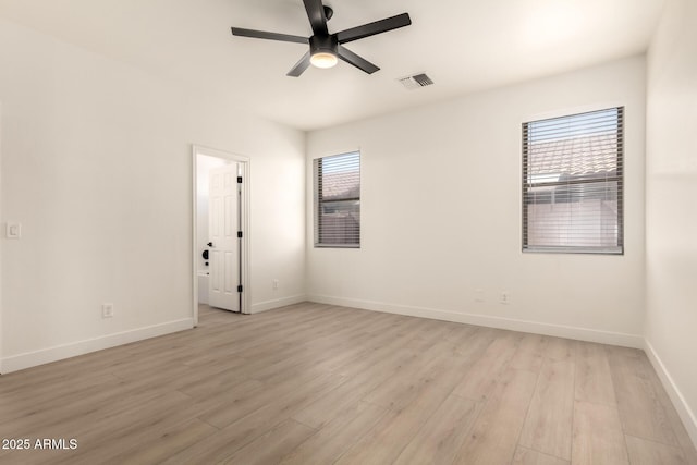 8928 E Crescent Ave, Mesa, AZ 85208 - spare room with light wood finished floors, ceiling fan, and baseboards