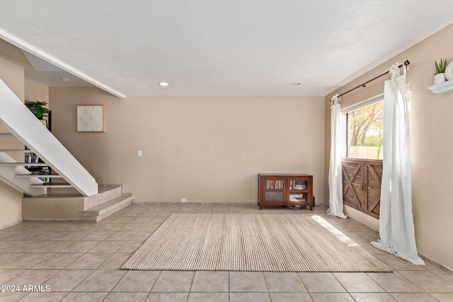 unfurnished room with light tile patterned floors