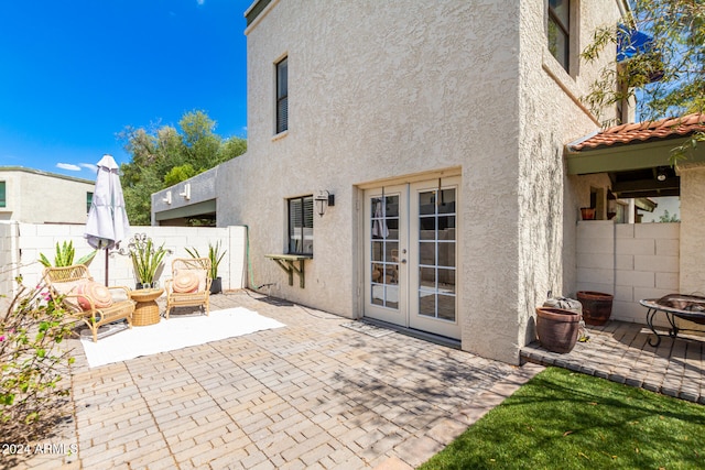 back of house with a patio and french doors