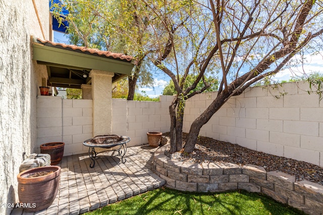 view of patio / terrace featuring an outdoor fire pit