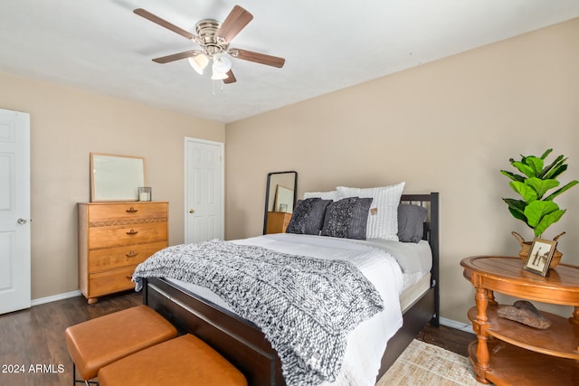 bedroom with ceiling fan and dark hardwood / wood-style flooring