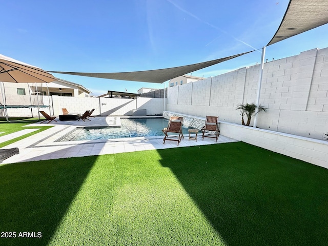 view of yard featuring a fenced in pool and a patio