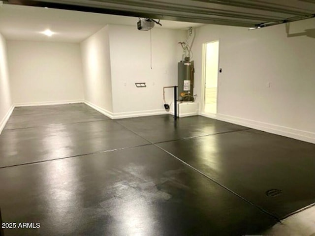 garage with a garage door opener and water heater