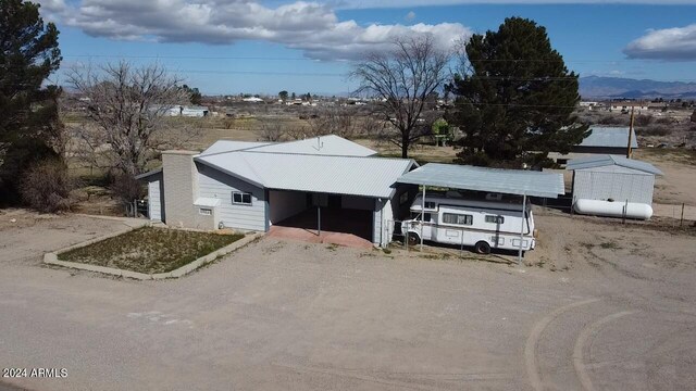 view of front of property featuring a carport